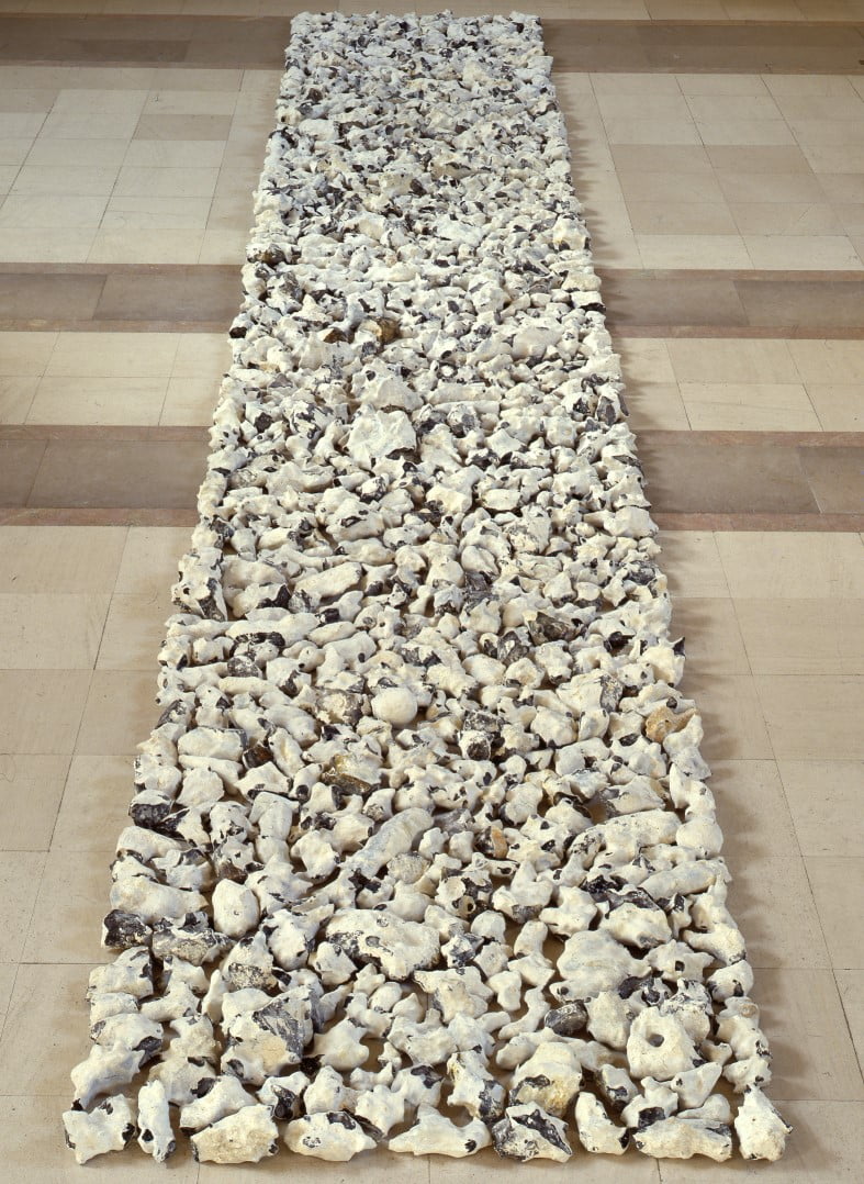 Wessex Flint Line by Richard Long. The works consists of a long rectangular line of white Hampshire flint, laid out on the floor